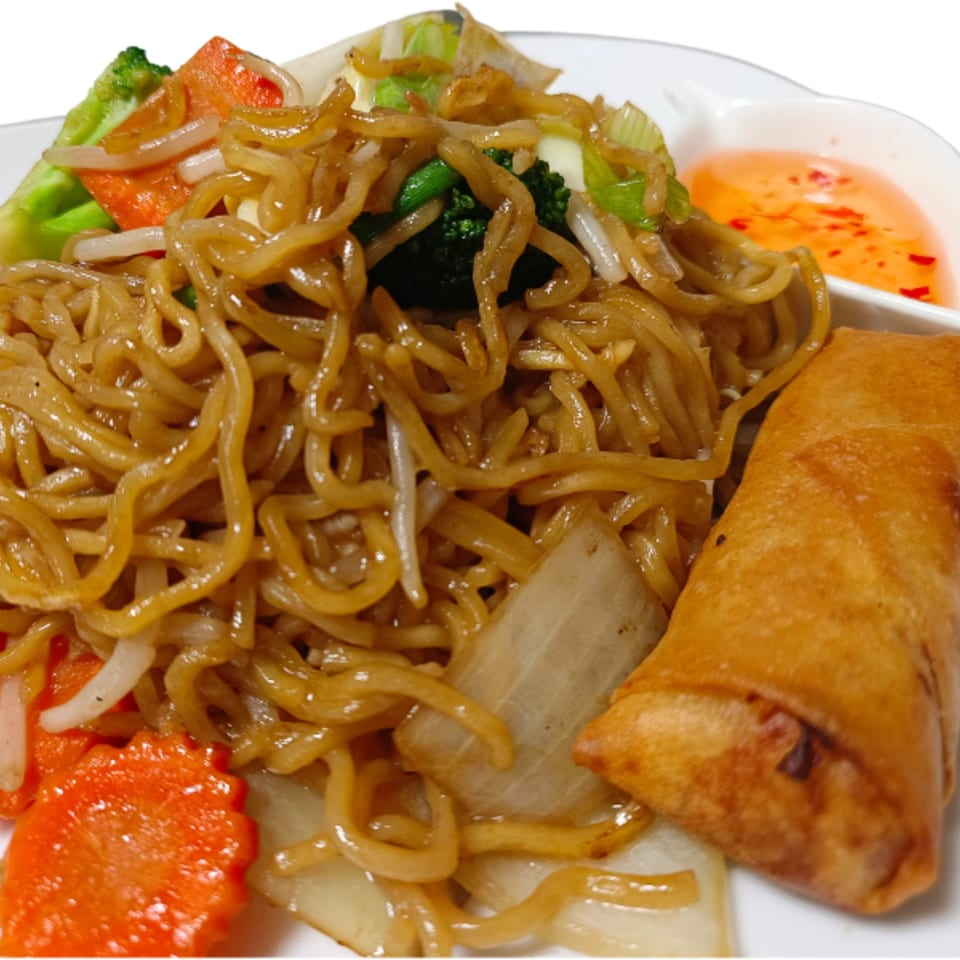 Thai stir-fried noodles with vegetables, an egg roll, and sweet chili sauce on a white plate.